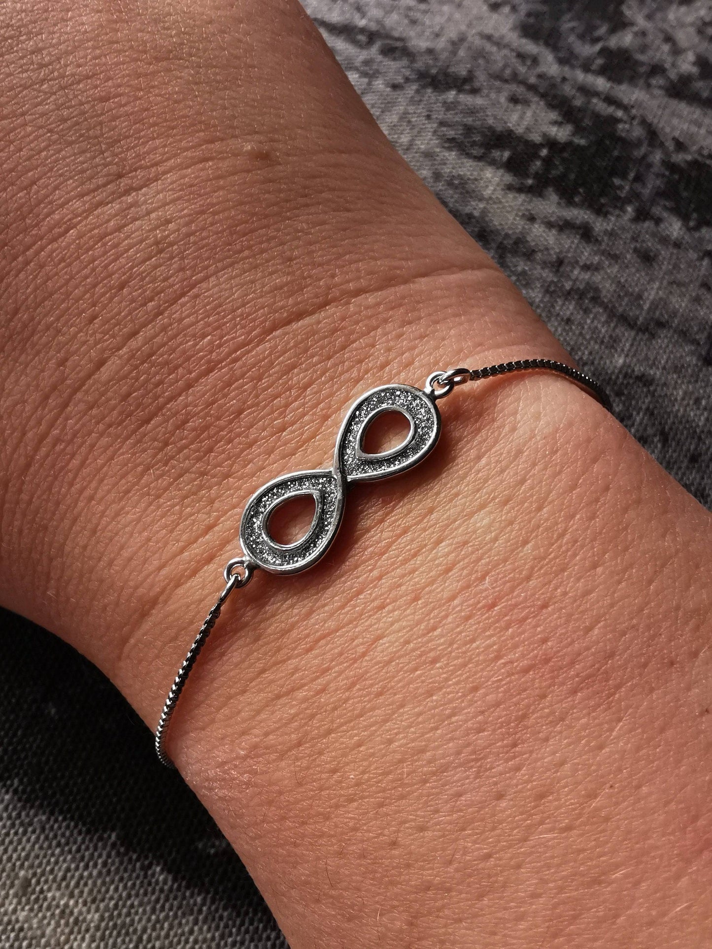 Infinity bracelet in sterling silver with frosted finish - Tamar and Talya