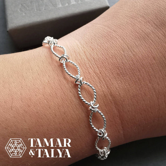 Silver Bracelet with a twist oval link design - Tamar and Talya