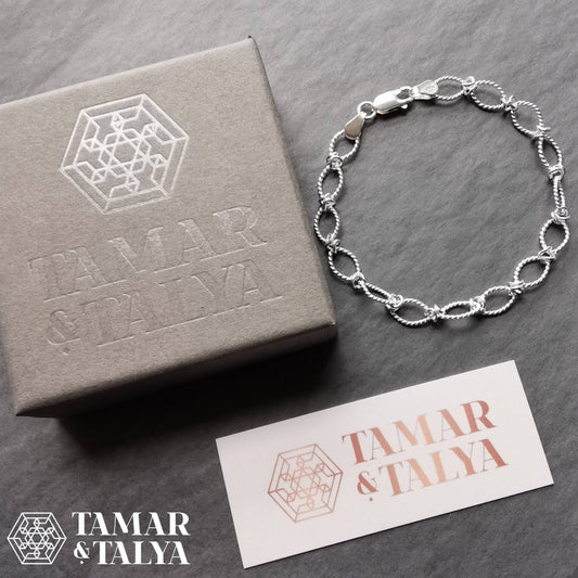 Silver Bracelet with a twist oval link design - Tamar and Talya